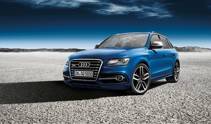 Blue Audi SQ5 TDI Exclusive parked in a desert landscape