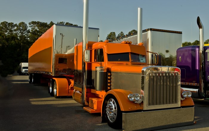 Bright Orange Peterbilt Truck with Trailer