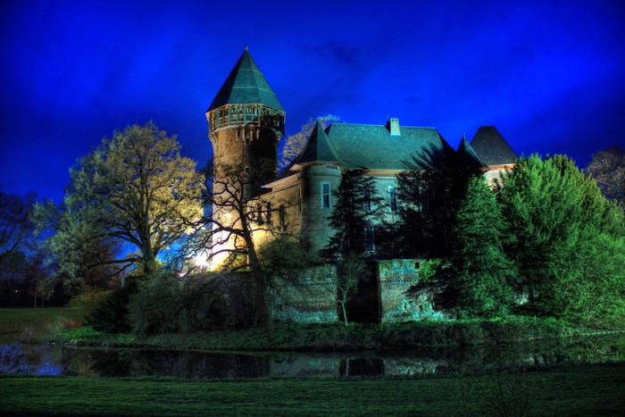 Burg Linn castle at night in Krefeld, Germany