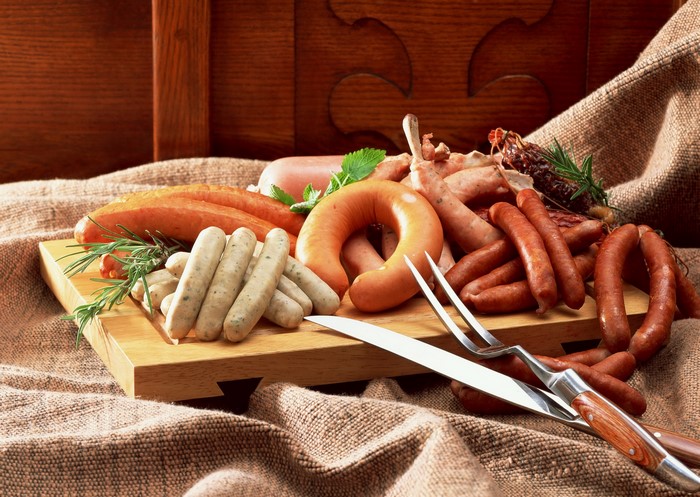 Assortment of sausages on a wooden board