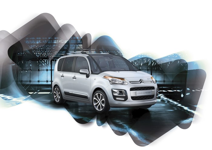 Silver Citroen C3 Picasso with abstract background