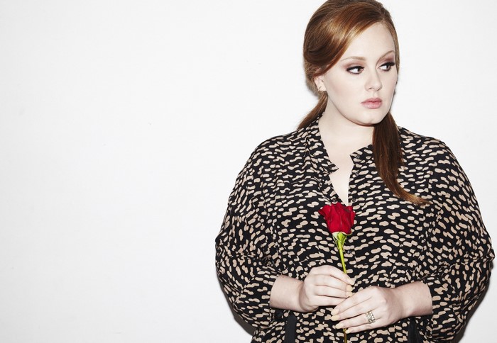 Adele holding a red rose