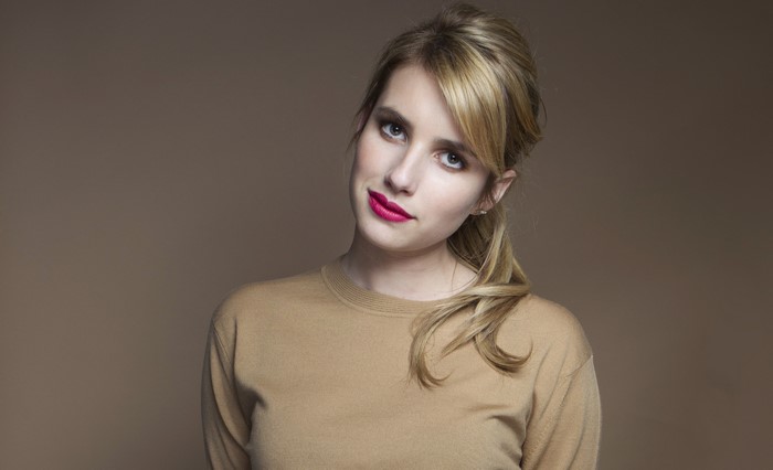 Emma Roberts with red lips and blonde hair