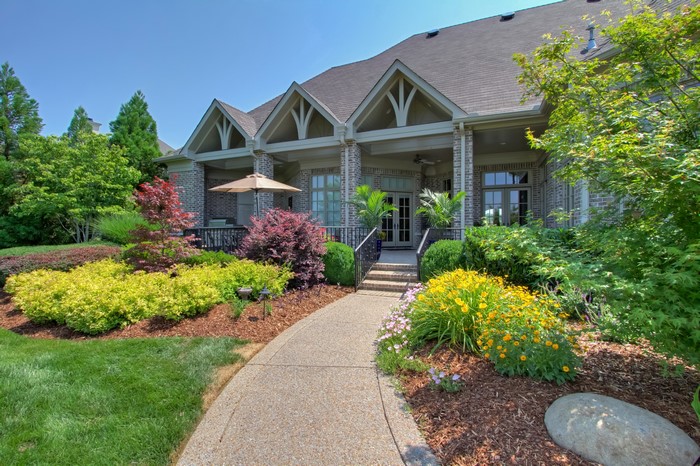 House with a landscaped garden and patio