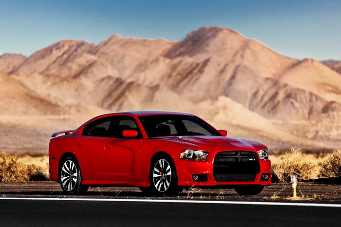 Red 2012 Dodge Charger SRT8 in desert landscape