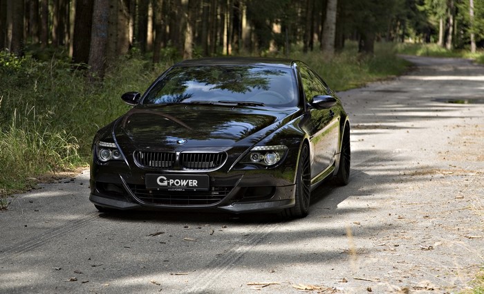 Black G-Power M6 Hurricane RR BMW on a forest road