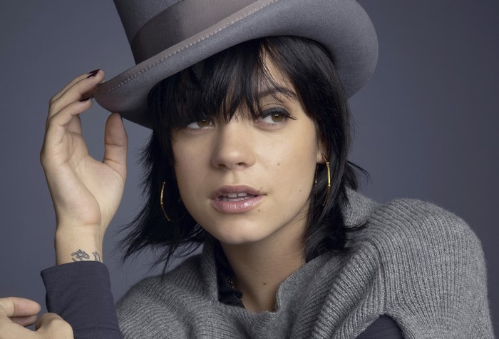 Lily Allen wearing a hat and sweater