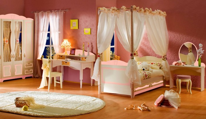 Girl's bedroom with canopy bed and vanity