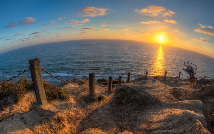 Sunset over the ocean from a cliff in San Diego, California