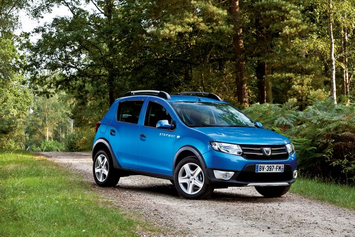 Blue Dacia Sandero Stepway on a dirt road