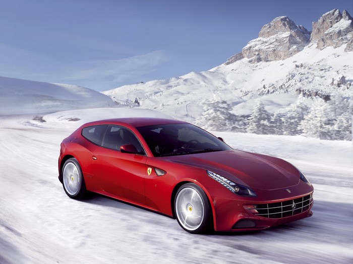 Red Ferrari FF driving on a snowy road