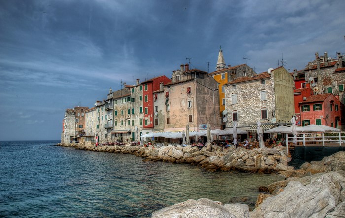 Colorful buildings on the coast of Croatia with rocky shore