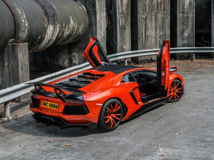 Orange Lamborghini Aventador with doors open