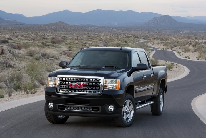 2011 GMC Sierra Denali truck on a desert road