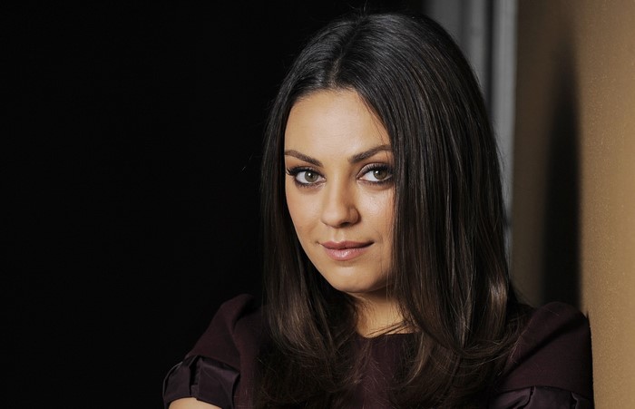 Mila Kunis looking to the side