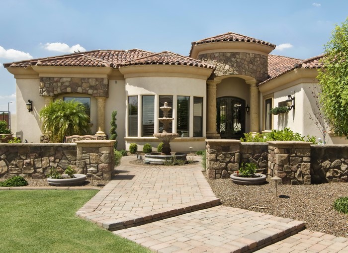 Luxury house with stone accents and fountain