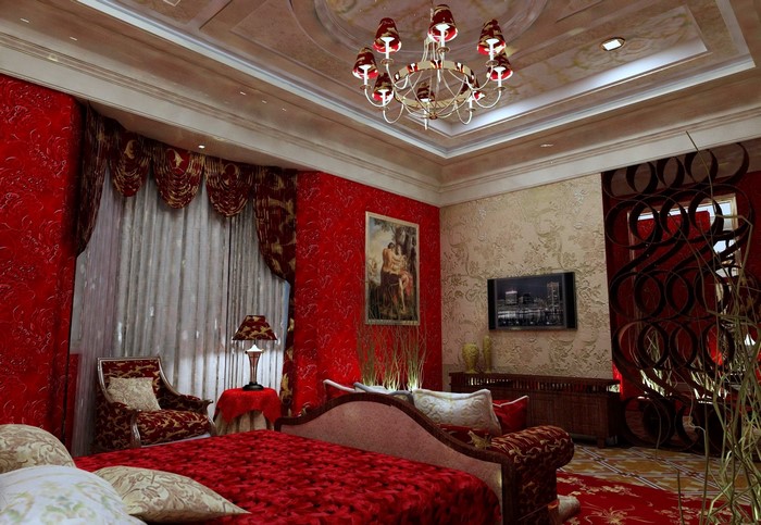 Luxurious bedroom with red and gold decor