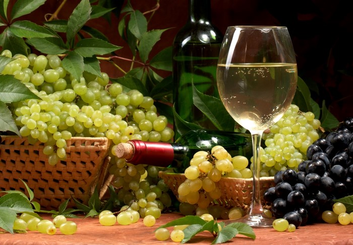 Still life with white wine and grapes