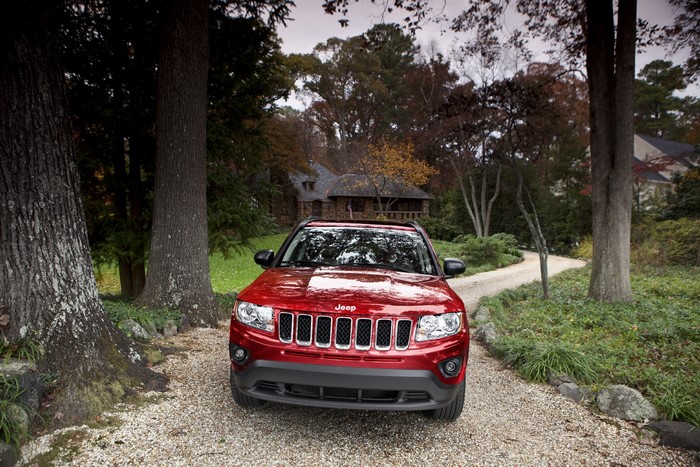 Red Jeep Compass on a Gravel Driveway