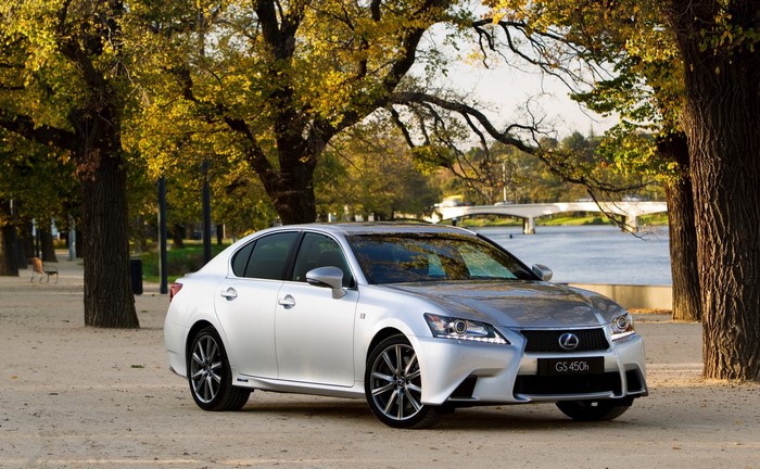 Silver Lexus GS 450h F-Sport parked by a lake