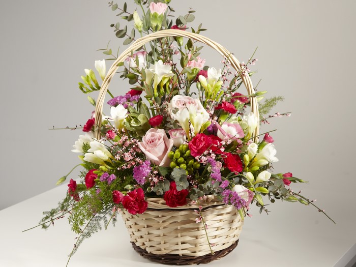 Flower bouquet in a wicker basket