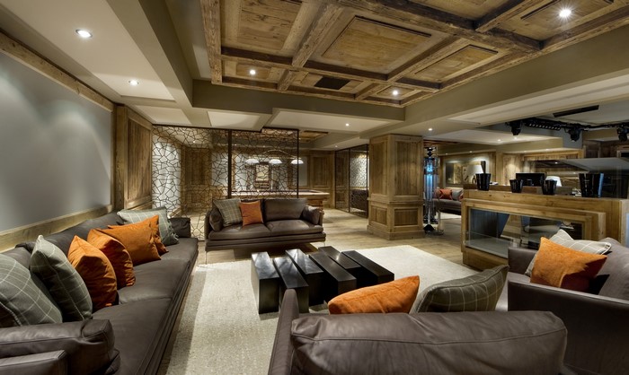 Luxury living room with leather sofas and wooden ceiling