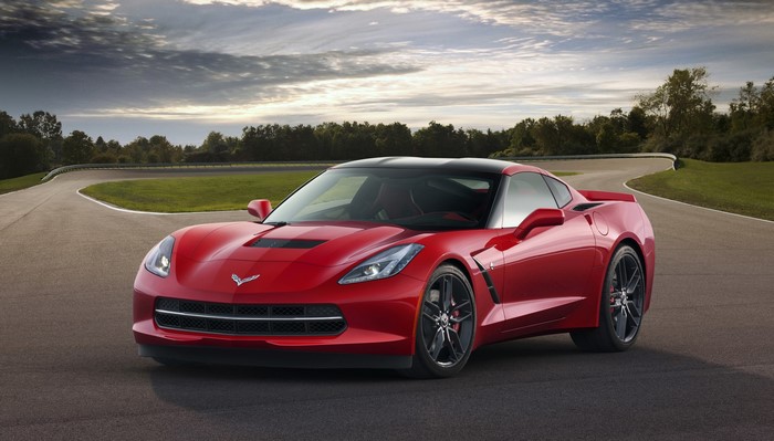 Red 2014 Chevrolet Corvette Stingray on a Racetrack