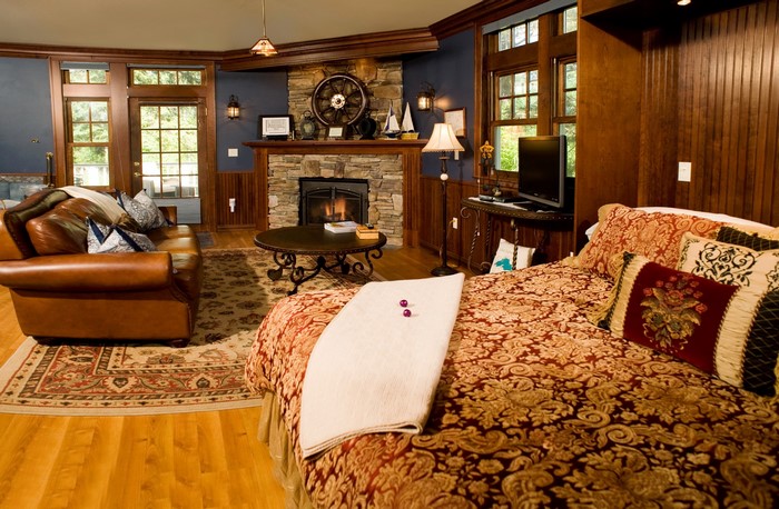 Living room with fireplace and bed