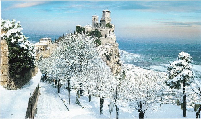 Winter scene in the Republic of San Marino with a fortress covered in snow