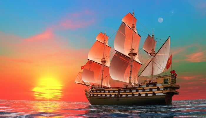 Tall ship sailing at sunset with moon in sky