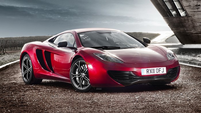 Red McLaren MP4-12C parked outdoors