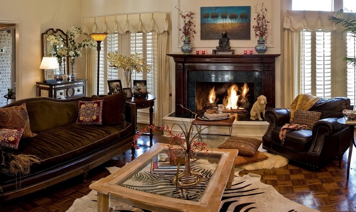 Living room with fireplace, sofa, and armchair