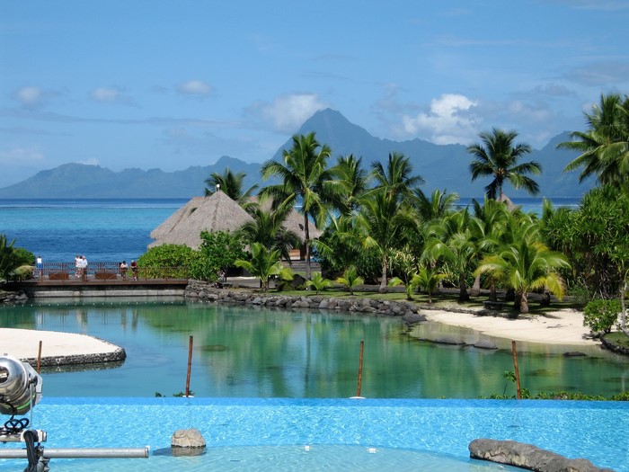 Tropical resort with infinity pool and mountains