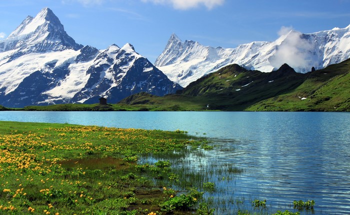 Lake and snow-capped mountains in Grindelwald, Switzerland