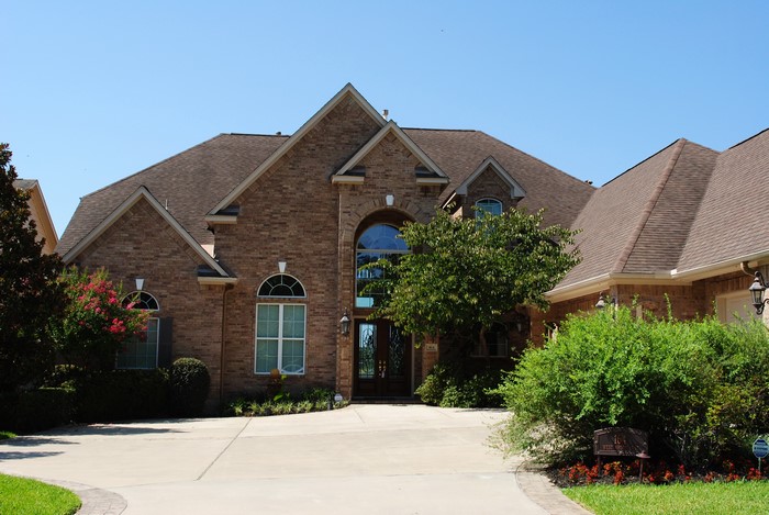 Brick Mansion with Driveway and Landscaping