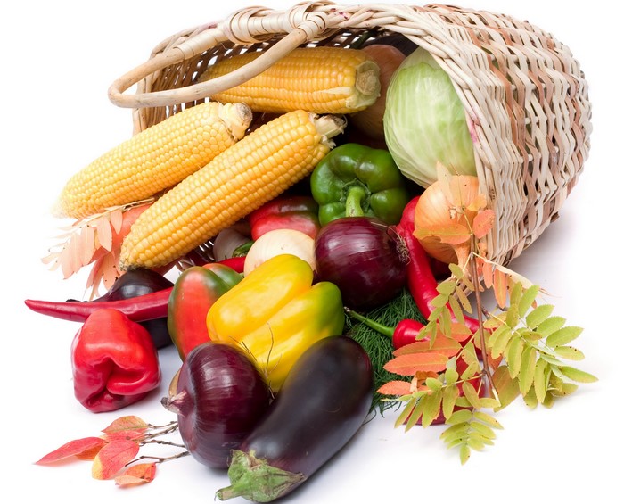 Corn, Bell Peppers, and other vegetables in a wicker basket