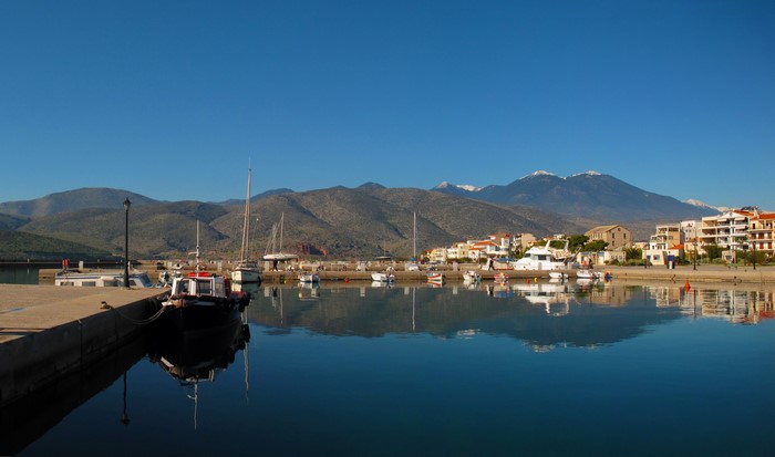 Itea, Greece harbor with boats and mountains