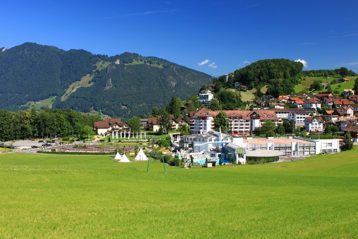Morschach, Switzerland with mountains and green fields
