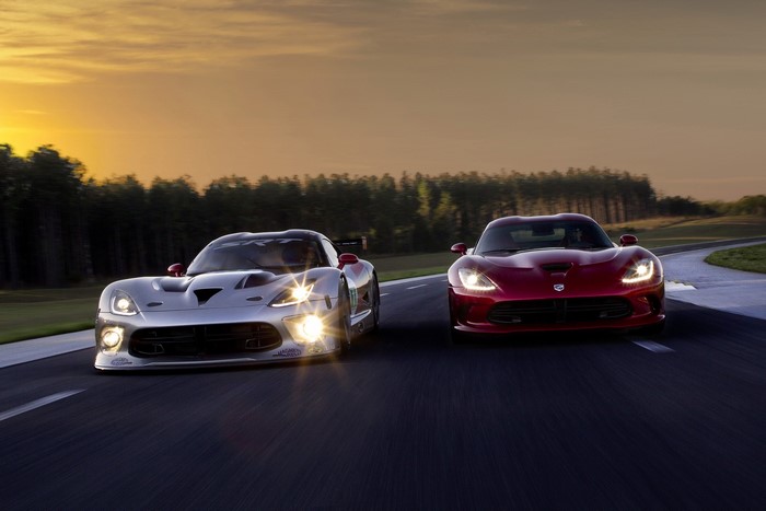 Two Dodge Vipers on a Racetrack at Sunset