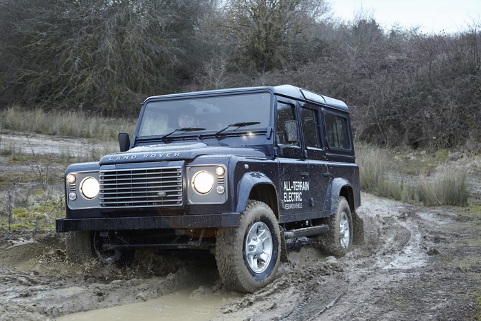 Land Rover Defender Electric driving through mud