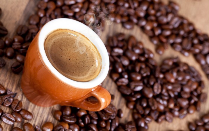Espresso cup with coffee beans