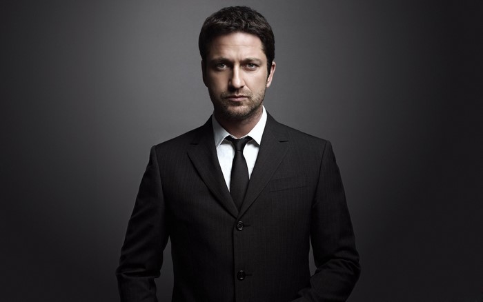 Gerard Butler wearing a suit and tie