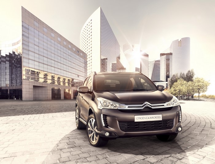 Citroen C4 Aircross parked in front of modern buildings