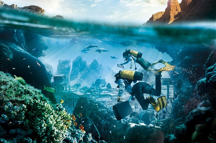 Divers explore underwater ruins with dolphins