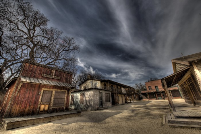 Old Western Town Buildings Under Dramatic Sky