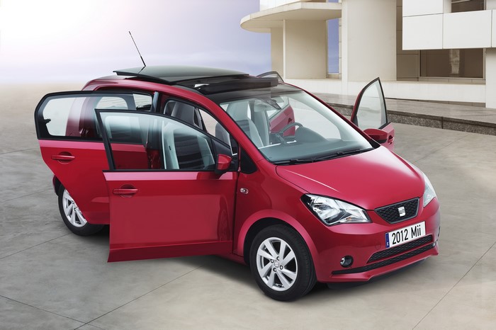 Red 2012 Seat Mii with opened doors and sunroof