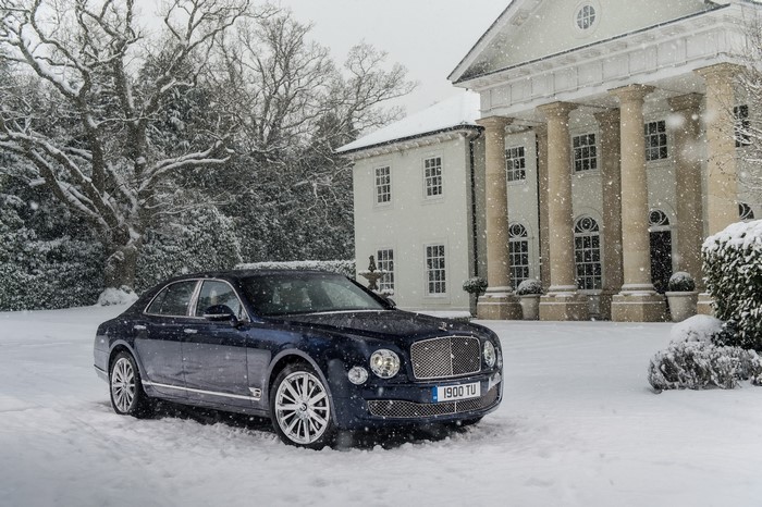 Bentley Mulsanne in the snow in front of a mansion