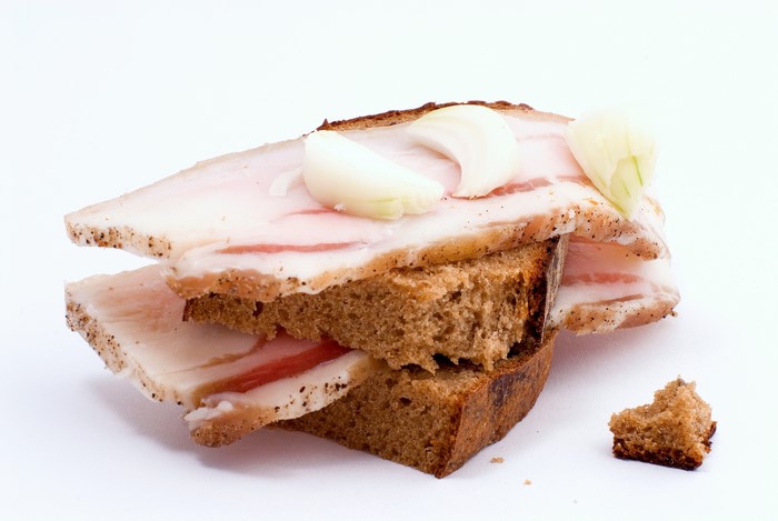 Salo sandwich with onion on rye bread