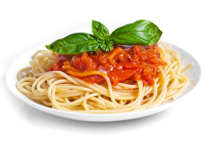 Spaghetti with tomato sauce and basil on a plate