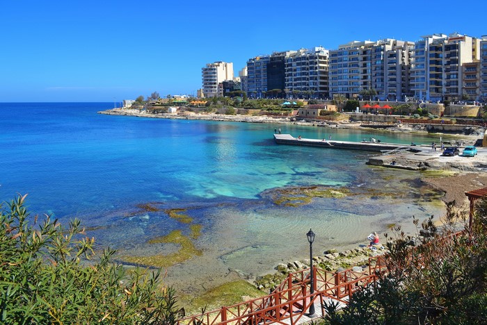 Sliema, Malta coast with clear blue sea and buildings
